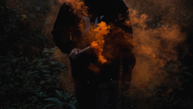 Man in Mask Black Jacket
